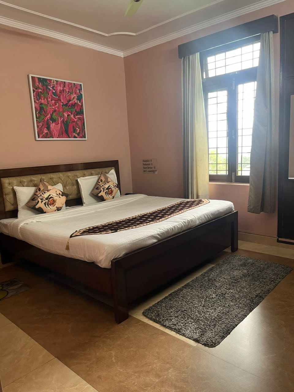 Guest room interior with comfortable bed at Hill View Homes